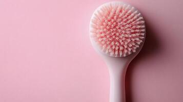 Innovative pink facial cleansing brush designed for gentle skincare routines photo