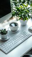 Modern workspace with plants and technology in a bright office setting during daylight hours photo