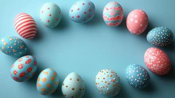 Decorative Easter eggs arranged in a circular pattern on a blue background during spring celebration photo