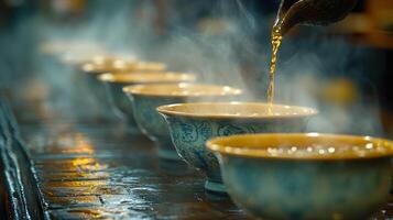 Pouring steaming tea into clay bowls in a serene setting with natural light photo