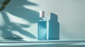 Clear liquid soap dispenser on a light blue background with bubbles and a pump top photo