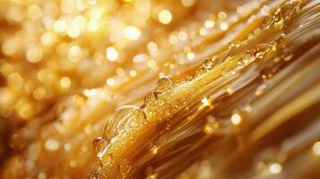 Golden liquid with bubbles flowing down in a mesmerizing pattern photo