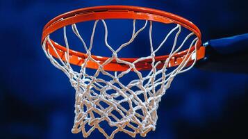 Basketball approaches the hoop during an afternoon game at a local court in summer photo