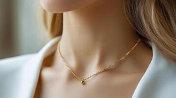 Elegant young woman wearing a necklace in a cozy indoor setting with soft lighting photo