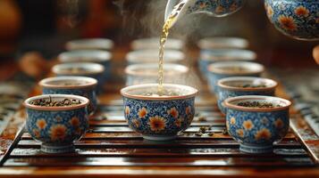Pouring steaming tea into clay bowls in a serene setting with natural light photo