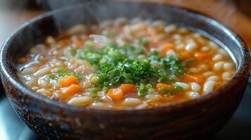Delicious steaming vegetable soup with beans and herbs in a rustic bowl photo
