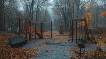 Playgrounds in autumn reveal deserted swings and slides in quiet neighborhood park photo