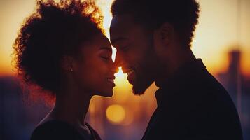 Couple sharing a tender moment during sunset silhouette in an urban setting photo