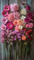 Bright pink flowers arranged artistically on a wooden background for decoration or design purposes photo