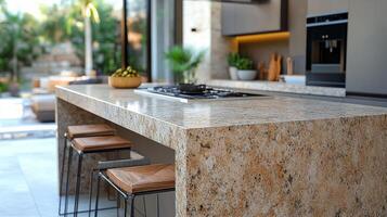 Modern kitchen design with natural light and elegant stone island in serene garden view photo