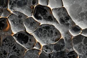 Water droplets reflecting light on a textured surface creating an abstract design in a close-up view photo