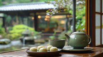 Tranquil tea ceremony with matcha and sweets in a serene mountain setting photo