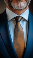 Man in a tailored suit adjusting his tie in a classy indoor setting during the daytime photo