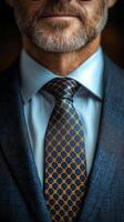 Man in a tailored suit adjusting his tie in a classy indoor setting during the daytime photo