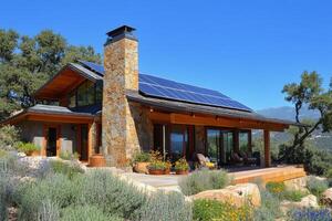 Solar powered cottage nestled in green landscape with mountain backdrop photo