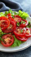 Fresh tomato salad with leafy greens and spices for a healthy meal photo