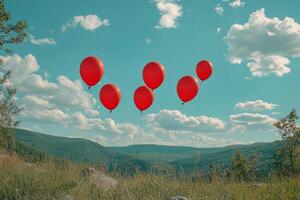 Colorful balloons floating in a bright blue sky with fluffy clouds during the day photo