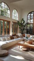 Cozy and Stylish Living Room with Abundant Natural Light and Greenery photo