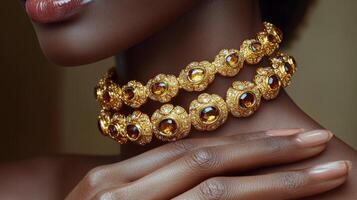 Elegant hand adorned with a triple strand pearl bracelet on silky fabric photo