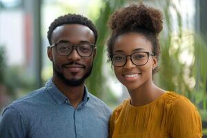 Young couple poses together in a neutral space with crossed arms and serious expressions photo