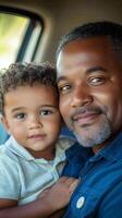 Father and son enjoying a moment outdoors in a lush green setting photo