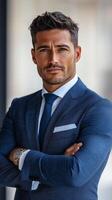 Confident businessman poses outdoors in formal attire with arms crossed in urban setting photo