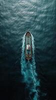 Large cargo ship navigating through calm ocean waters during sunset photo