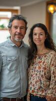 Couple poses together in a cozy indoor setting during a relaxed afternoon photo