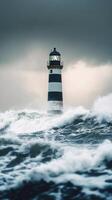 Stormy ocean waves crashing near a striped lighthouse during twilight hours photo