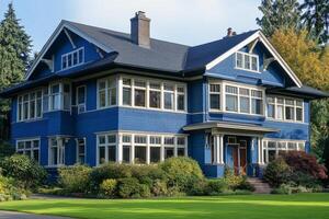 Bright blue house with elegant balcony and lush greenery in a picturesque neighborhood on a sunny day photo