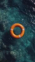 Orange lifebuoy sits on rain-soaked pavement outside residential building in urban setting photo