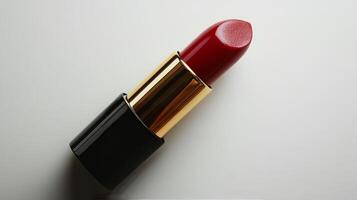 Bright red lipstick swatched on smooth surface showcasing elegant packaging and rich color photo