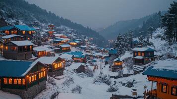 Snow-covered village nestled in mountains during dusk with twinkling lights and serene atmosphere photo