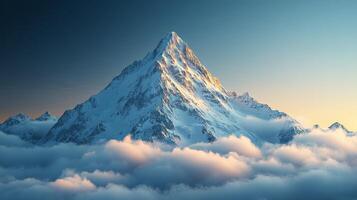 Majestic snowy mountain peak rises above the clouds in clear sky during bright daylight photo