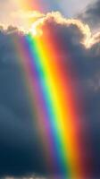 Vibrant rainbow cascading through the clouds during sunset over a serene sky photo