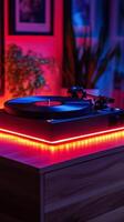 Stylish record player with colorful lighting in a cozy indoor setting photo