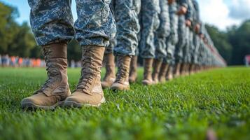 Soldiers marching through a muddy trail in a dense forest during a training exercise photo