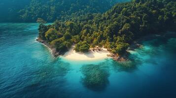 Beautiful tropical island with white sand beach and crystal clear water surrounded by lush greenery photo