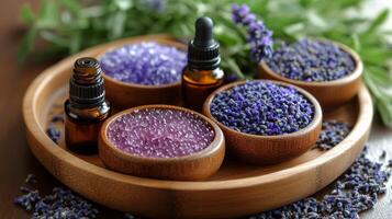 Natural lavender essential oils and flowers arranged on a wooden tray in a calming indoor setting photo