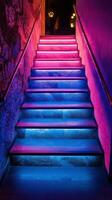 Staircase illuminated by vibrant neon lights in a modern urban setting photo