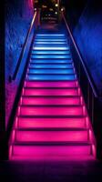Staircase illuminated by vibrant neon lights in a modern urban setting photo