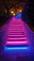 Staircase illuminated by vibrant neon lights in a modern urban setting photo