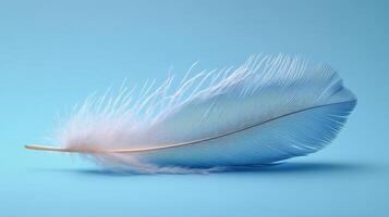 Delicate feather resting on soft blue fabric in tranquil natural light photo