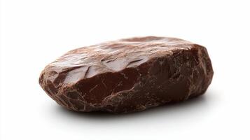 Delicious dark chocolate pieces and cocoa nibs on a white background for dessert lovers photo