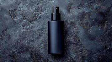 Amber glass spray bottle filled with liquid displayed against a dark background photo