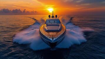 Luxury yacht cruising in ocean waves at sunset with vibrant sky colors photo