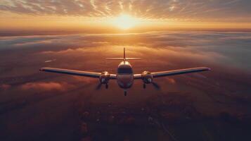 Unique aerial view of a vintage aircraft flying over scenic landscape with clouds and mountains photo