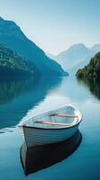 Tranquil wooden boat floating in serene foggy waters surrounded by lush forests photo