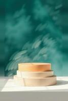 three-tiered display platform with a teal green backdrop photo