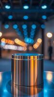 sleek metallic cylinder on reflective surface with bokeh lights photo